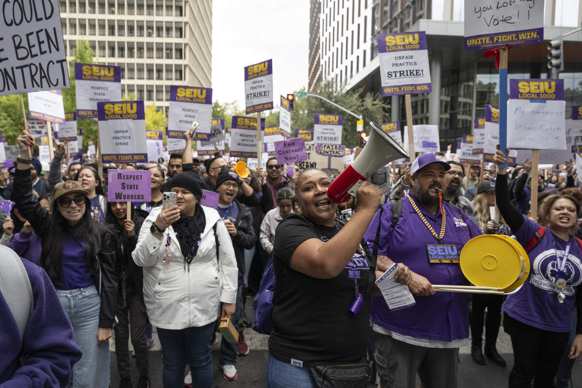 SEIU 1000 members march down P Street during a strike  in Sacramento on Wednesday, Oct. 21, 2026.